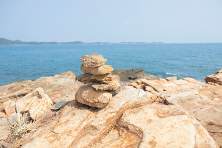 Rock on the rocks seen from above, the mountain has blue sea, island and sky as background. Eco tourism concept.の写真素材
