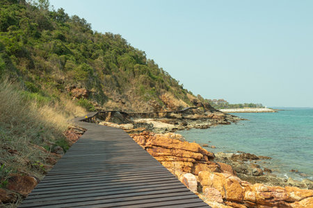 brown wooden bridges along the hillsides rocks on the beach are rocks and  rocky mountains and sea close to island, eco-tourism conceptの写真素材