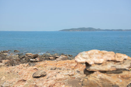 Rock on the rocks seen from above, the mountain has blue sea, island and sky as background. Eco tourism concept.の写真素材