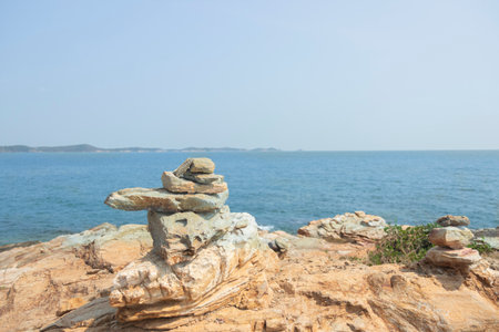 Rock on the rocks seen from above, the mountain has blue sea, island and sky as background. Eco tourism concept.の写真素材