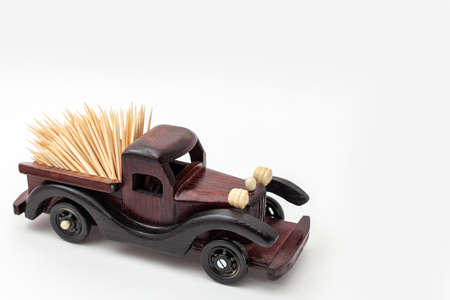 wooden toy car isolated on white backgroundの写真素材