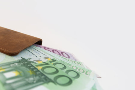 wallet with euro sticking out of it