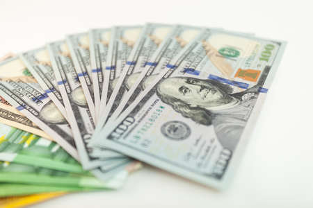 euro and dollars banknotes on isolated white backgroundの写真素材