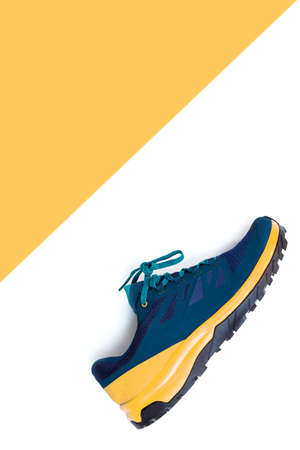 blue sneakers on a white isolated backgroundの写真素材