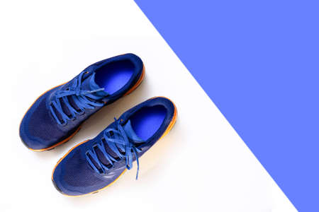blue sneakers on a white isolated backgroundの写真素材