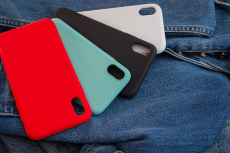 multi-colored mobile phone case on a denim background