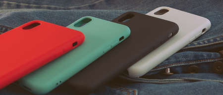 multi-colored mobile phone case on a denim backgroundの写真素材