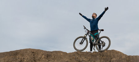 panorama Bearded mountain bicyclist rides mountains