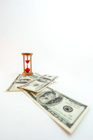 100 dollar bill with hourglass on white isolated background