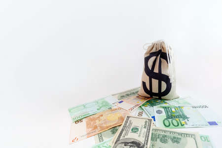pouch with dollar sign on us dollar and euro banknotesの写真素材
