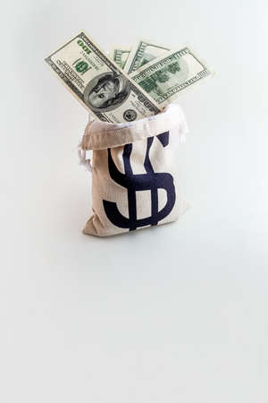 pouch with dollar sign on us dollar and euro banknotesの写真素材