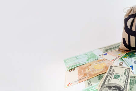panorama pouch with dollar sign on us dollar and euro banknotesの写真素材