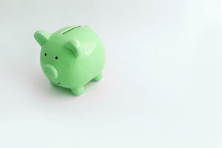 Piggy bank in the shape of a pig on an isolated white backgroundの写真素材