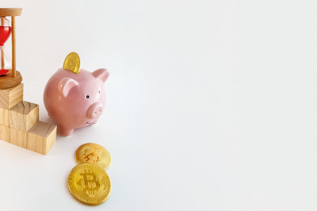 panorama Piggy bank with bitcoin coins, hourglass and wood cubes growing graphic on isolated white backgroundの写真素材