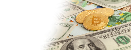 bitcoins on a texture background of euro and dollars panorama
