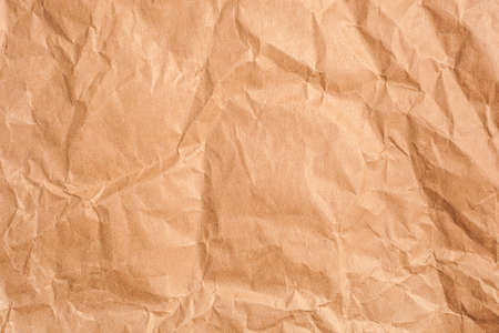 texture of old yellow crumpled paperの写真素材
