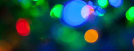 panorama bokeh texture of multicolored christmas and new year lights