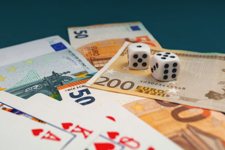 Chisinau, Moldova - 20. 12. 2020 dice, playing cards on a green cloth in a casino dollars and euro...