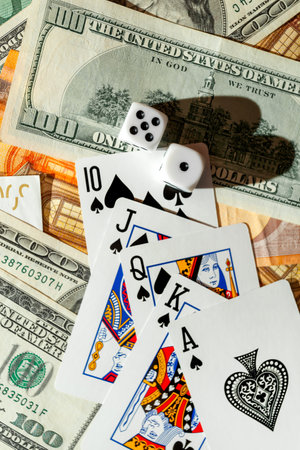Chisinau, Moldova - 20.12.2020 dice, playing cards on a green cloth in a casino dollars and euro billsの写真素材