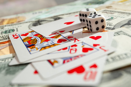 Chisinau, Moldova - 20.12.2020 dice, playing cards on a green cloth in a casino dollars and euro...