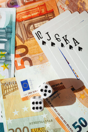 Chisinau, Moldova - 20.12.2020 dice, playing cards on a green cloth in a casino dollars and euro...