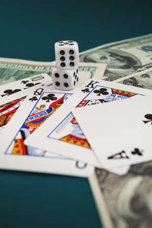 Chisinau, Moldova - 20.12.2020 dice, playing cards on a green cloth in a casino dollars and euro billsのeditorial素材
