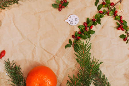 Christmas mockup for postcard with dry fruits, craft paper, gift box, handmade christmas toysの写真素材