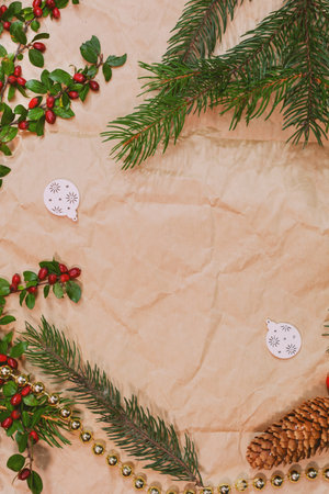Christmas mockup for postcard with dry fruits, craft paper, gift box, handmade christmas toysの写真素材
