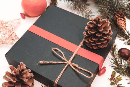 Christmas mockup for postcard with dry fruits, craft paper, gift box, handmade christmas toysの写真素材