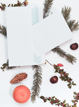 Christmas mockup for postcard with dry fruits, craft paper, gift box, handmade christmas toys