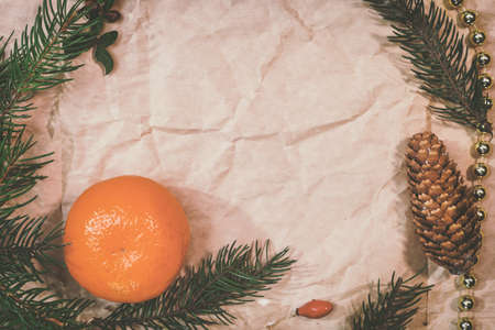 Christmas mockup for postcard with dry fruits, craft paper, gift box, handmade christmas toysの写真素材