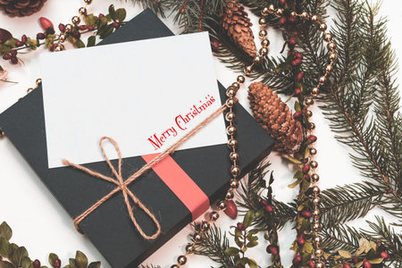 Christmas mockup for postcard with dry fruits, craft paper, gift box, handmade christmas toysの写真素材