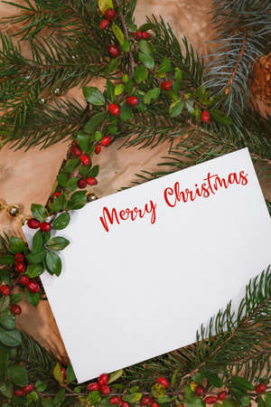 Christmas mockup for postcard with dry fruits, craft paper, gift box, handmade christmas toysの写真素材