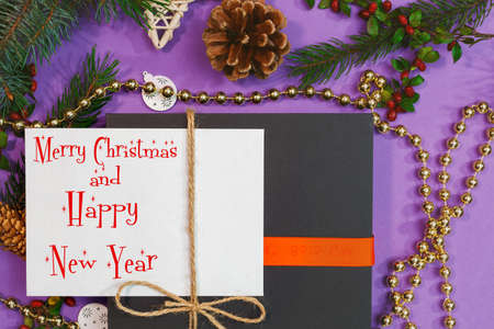 Christmas mockup for postcard with dry fruits, craft paper, gift box, handmade christmas toysの写真素材