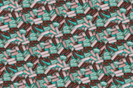 multicolored pills and capsules on a green backgroundの写真素材