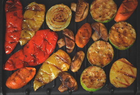 Top view close up of various vegetables being prepared on a grilling pan.の写真素材