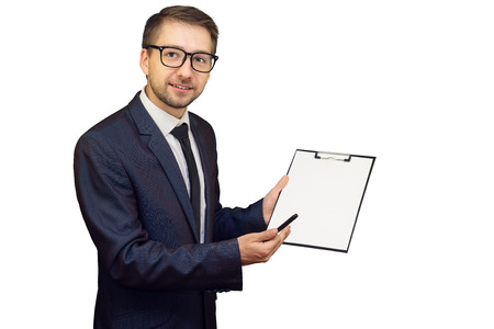 Young smiling business consultant pointing at notepad with blank sheet making presentation. Isolated on white background. Mock up, copy space for your text.の写真素材
