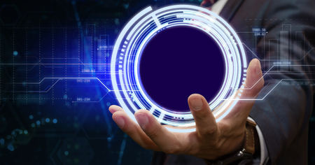 Close up of male businessman hand holding virtual button on digital screen. Presentation of new futuristic technologies. Modern job concept.の写真素材