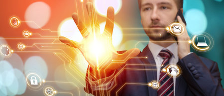 Cropped portrait of young handsome business man working in futuristic office talking on mobile phone...