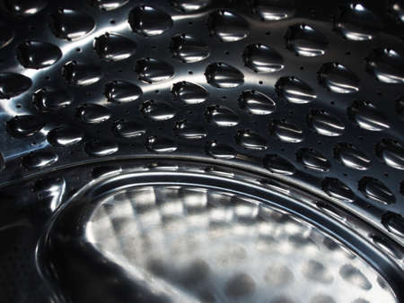 Abstract photo, a fragment of a stamped metal object. Close-up of the mechanism details.の写真素材
