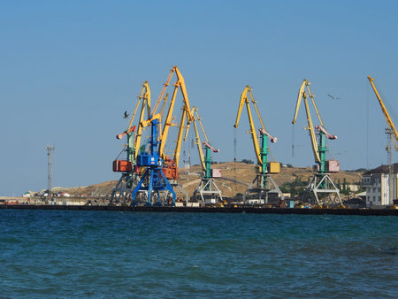 Portal, transshipment crane on the pier of the sea, cargo port. Terminal sea, cargo port.