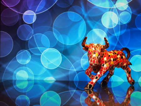 Bull, stylized figure on a blue background, symbol of 2021. There is free space for text on the photo.の写真素材