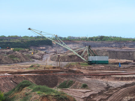 Amber quarry, a place of open-pit amber mining, equipment and machines used in the development of the field. Mining, industrial production, mining industry.の写真素材