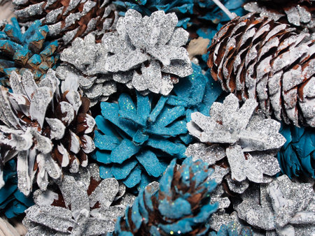 Christmas installation, colorful pine and fir cones in a basket. New Year and Christmas decoration, holiday atmosphere. close-upの写真素材