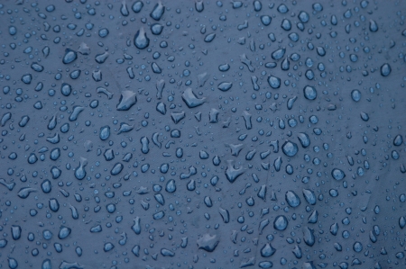 Raindrops on the blue tentの写真素材