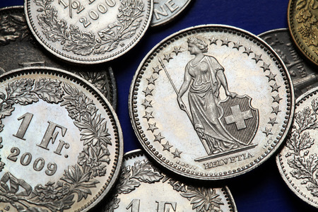 Coins of Switzerland. Standing Helvetia depicted in the Swiss one franc coins.の写真素材