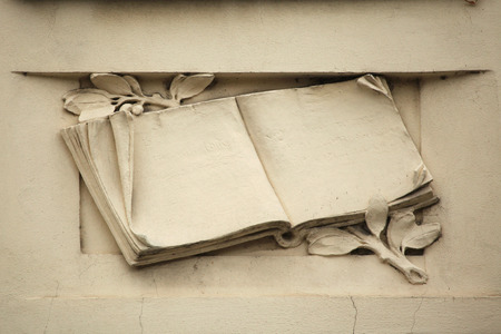 Medieval book. Stucco decoration on the Art Nouveau building in Prague, Czech Republic.の写真素材