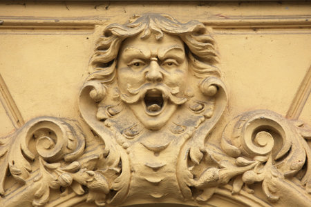 Funny mascaron on the Art Nouveau building in Prague, Czech Republic.の写真素材