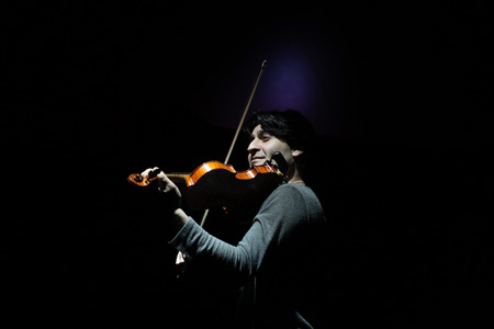 DRESDEN, GERMANY - MARCH 30, 2014: Talented Armenian violinist Edgar Hakobyan performs with Russian Grand Circus in Dresden, Germany, on March 30, 2014.のeditorial素材