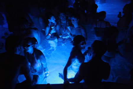 BUDAPEST, HUNGARY - NOVEMBER 2, 2013: Tourists enjoy the Magic Bath Party at the Lukacs Bath, a traditional night party in a historic outdoor thermal bath heated naturally by hot springs, in Budapest, Hungary, on November 2, 2013.のeditorial素材
